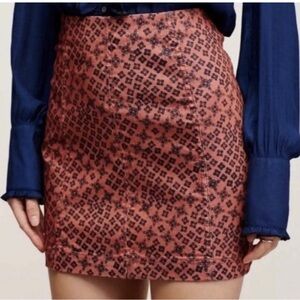 Free People Modern Femme mini skirt with dark geometric print.